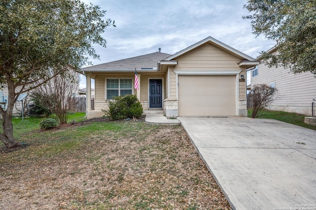 view of front of home featuring a front yard and a garage