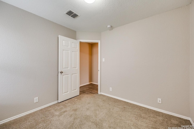 empty room featuring carpet flooring