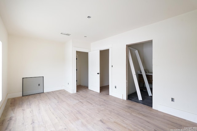 unfurnished bedroom featuring light hardwood / wood-style floors