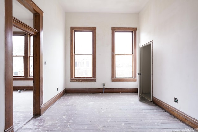 spare room featuring light wood-type flooring