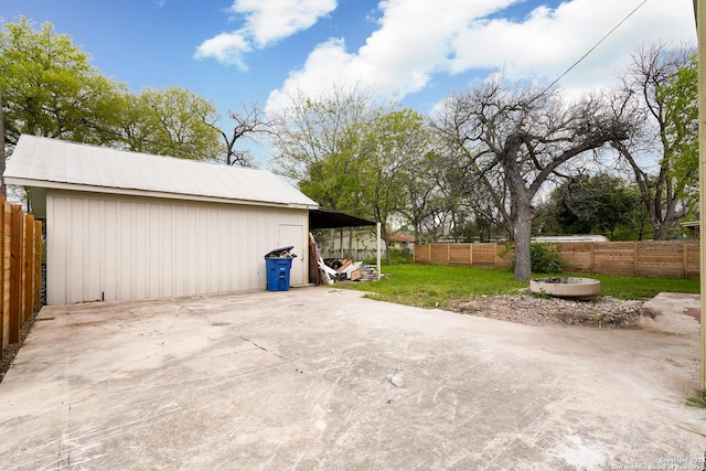 view of patio with an outdoor structure and a carport