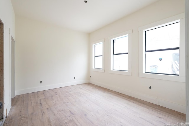 spare room featuring light hardwood / wood-style floors