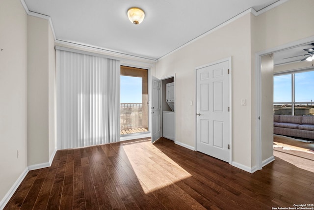 unfurnished room with ceiling fan, dark hardwood / wood-style flooring, and ornamental molding