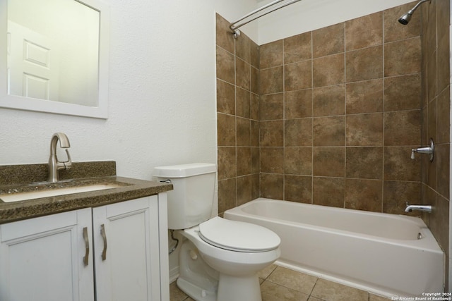 full bathroom with tile patterned floors, vanity, toilet, and tiled shower / bath