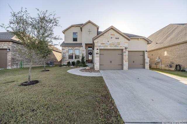 view of front of home featuring a front lawn, central AC unit, and a garage