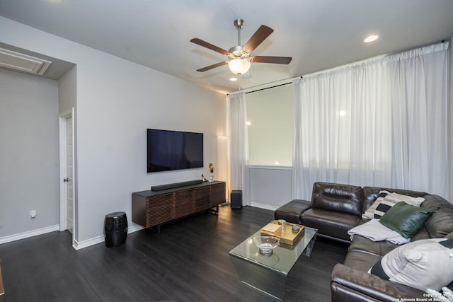 living room with dark hardwood / wood-style floors and ceiling fan