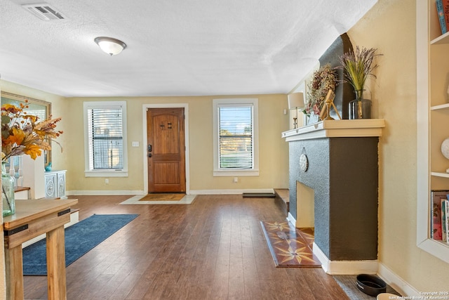 entrance foyer featuring hardwood / wood-style floors and a textured ceiling