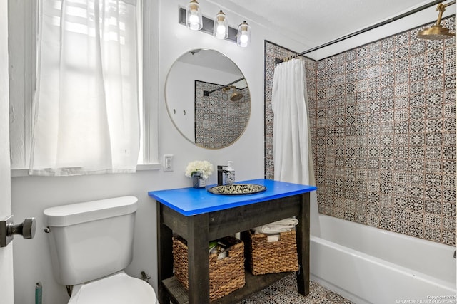 bathroom with shower / tub combo with curtain and toilet