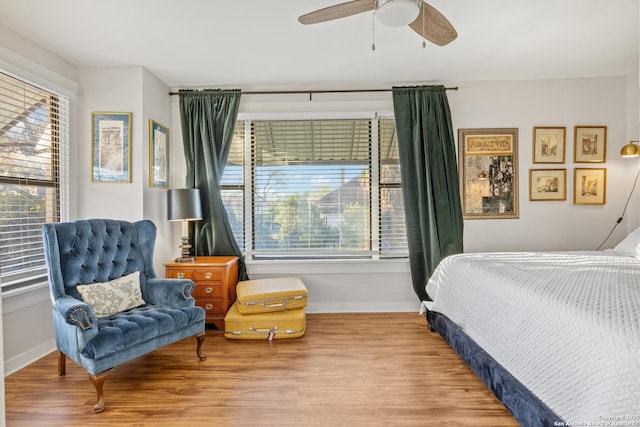 bedroom featuring hardwood / wood-style flooring and ceiling fan