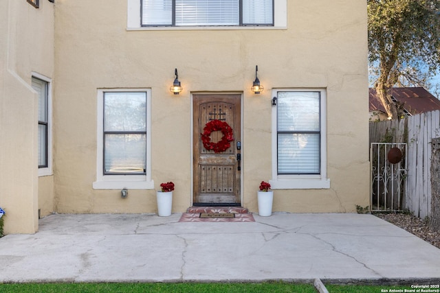 property entrance with a patio