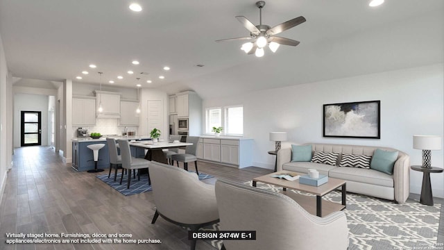 living room with ceiling fan, lofted ceiling, and hardwood / wood-style flooring