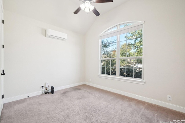 empty room featuring an AC wall unit, ceiling fan, light colored carpet, and vaulted ceiling