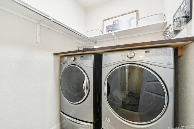 washroom with washer and dryer