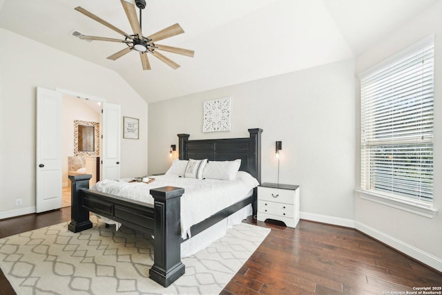 bedroom featuring ceiling fan, dark hardwood / wood-style floors, connected bathroom, and multiple windows