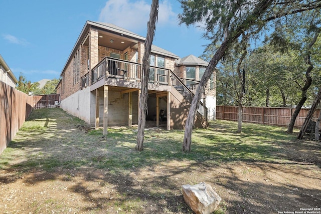 back of house featuring a wooden deck