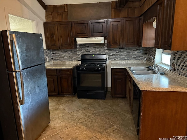 kitchen featuring sink, dark brown cabinets, backsplash, and black appliances