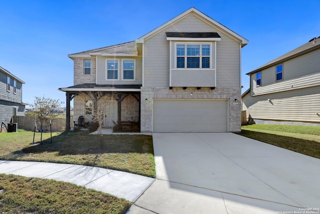 view of front of home featuring a front yard and a garage