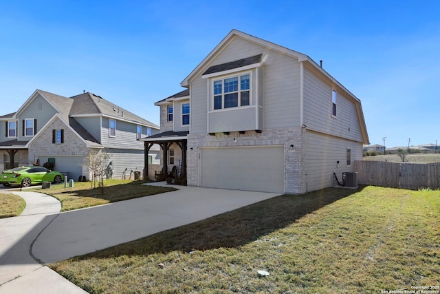 view of property with a front yard and a garage