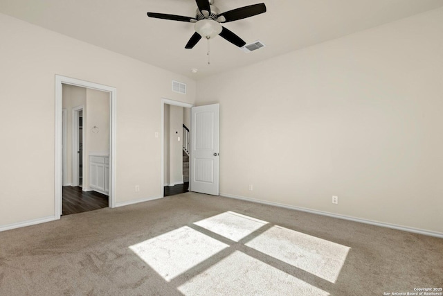 unfurnished bedroom featuring carpet floors and ceiling fan