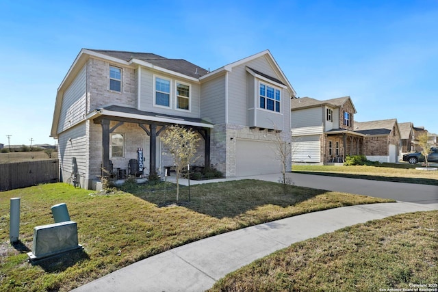 view of front facade with a front yard and a garage