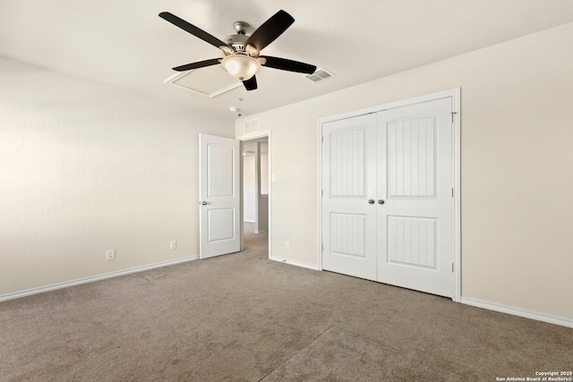 unfurnished bedroom with carpet floors, a closet, and ceiling fan