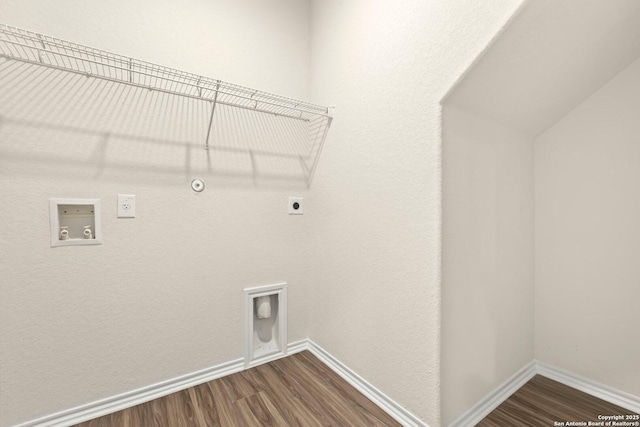 clothes washing area featuring hookup for an electric dryer, dark hardwood / wood-style floors, hookup for a gas dryer, and washer hookup