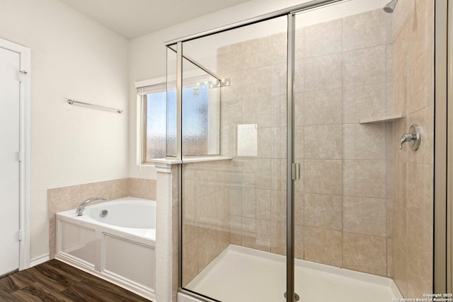 bathroom with plus walk in shower and hardwood / wood-style flooring