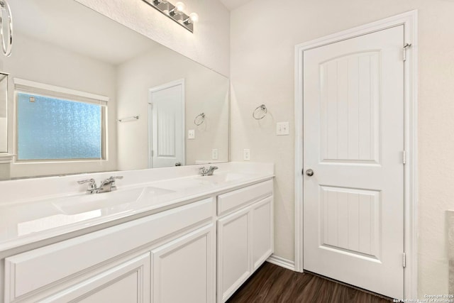 bathroom featuring vanity and wood-type flooring