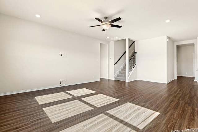 unfurnished room featuring ceiling fan and dark hardwood / wood-style floors