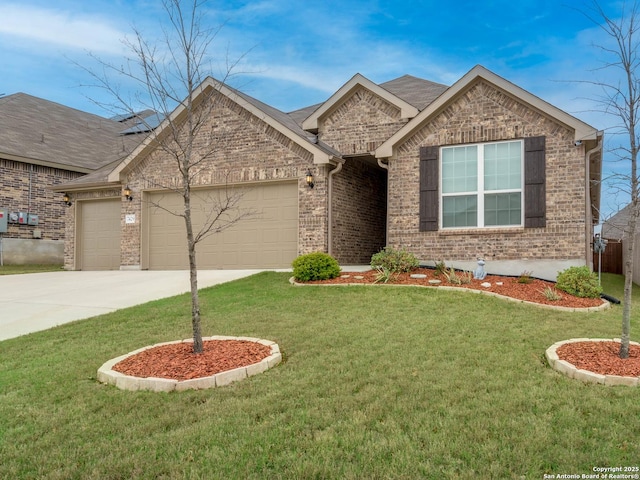 view of front of house featuring a garage and a front lawn