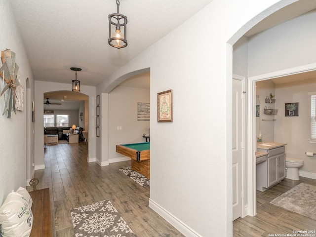 corridor featuring hardwood / wood-style floors