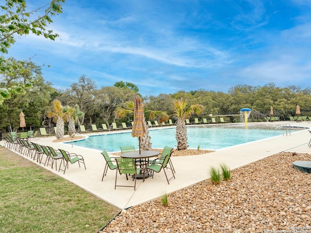 view of pool featuring pool water feature