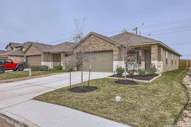 view of front of home with a front yard and a garage