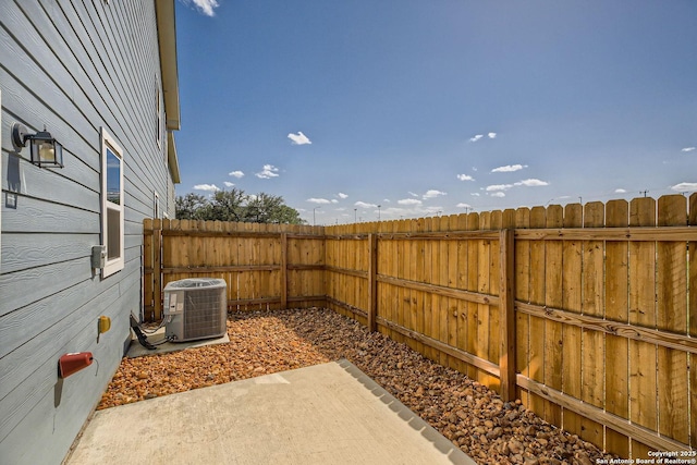 view of yard with a patio and central AC