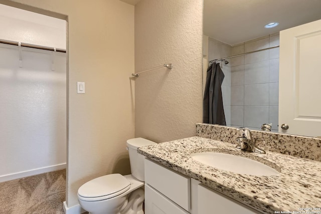 bathroom featuring a shower with curtain, vanity, and toilet