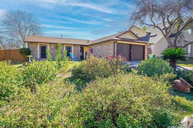 ranch-style home featuring a garage