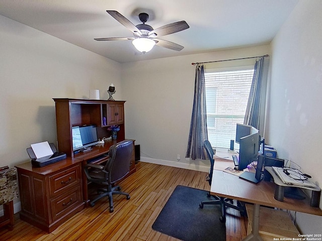 office featuring light hardwood / wood-style flooring and ceiling fan