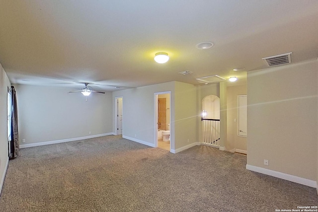 unfurnished room with ceiling fan and carpet