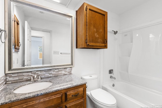 full bathroom with backsplash, vanity, shower / bath combination, and toilet