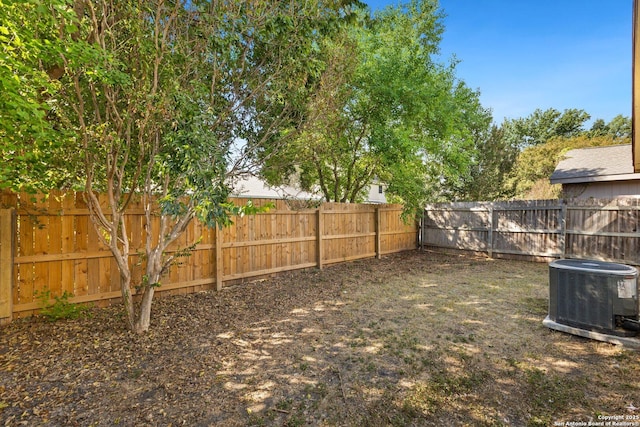 view of yard featuring central AC