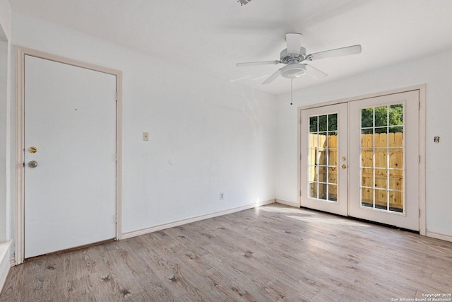 unfurnished room with french doors, light hardwood / wood-style floors, and ceiling fan