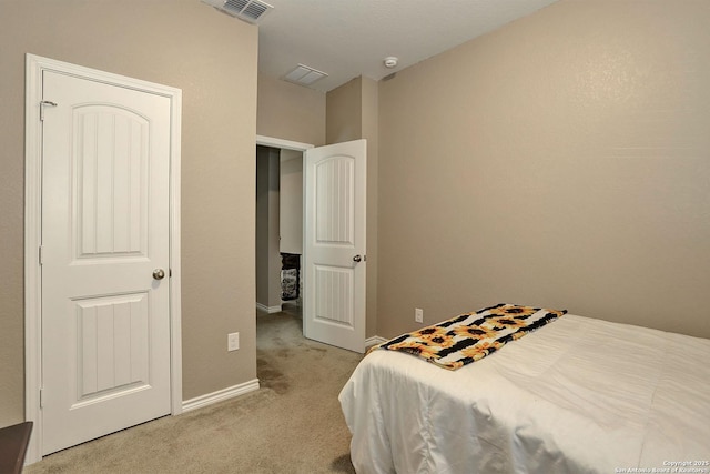 bedroom featuring light colored carpet