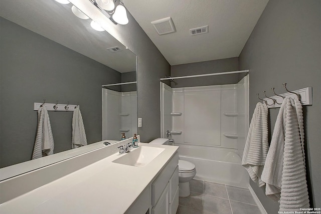 full bathroom with vanity, tile patterned floors, toilet, a textured ceiling, and tub / shower combination