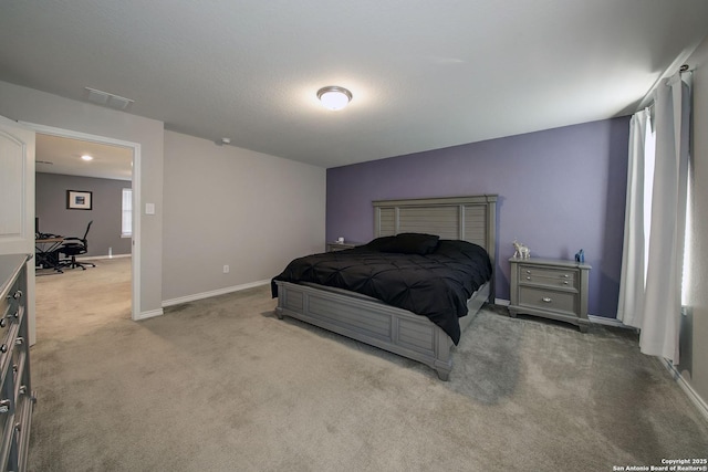 bedroom featuring light carpet