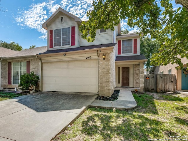 view of front of home featuring a garage and a front lawn