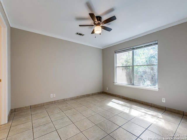 unfurnished room with ceiling fan, light tile patterned floors, and ornamental molding