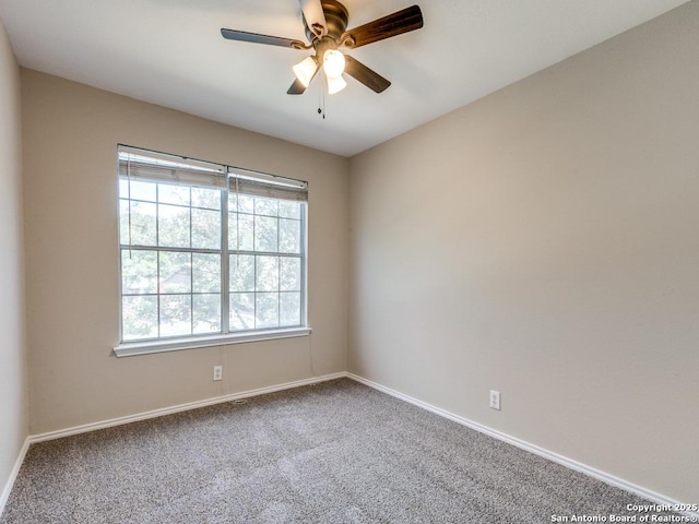 carpeted empty room with ceiling fan