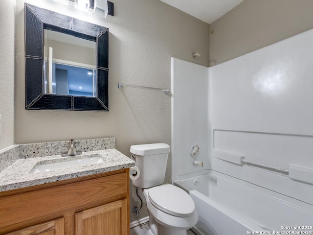 full bathroom featuring shower / washtub combination, vanity, and toilet