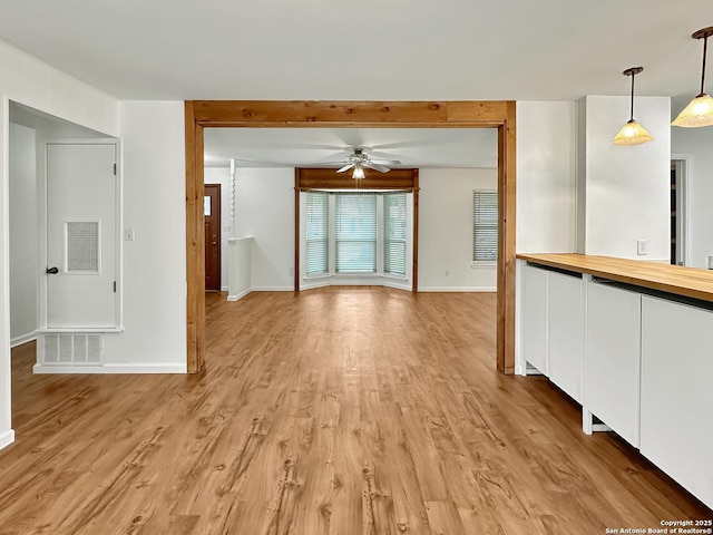 interior space with ceiling fan and light wood-type flooring