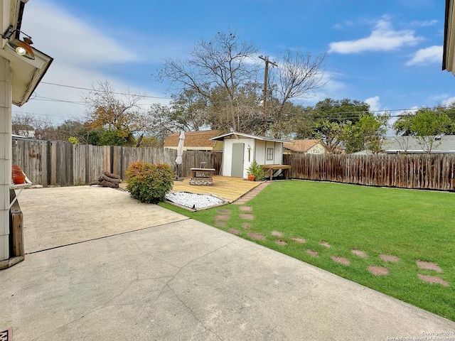 view of yard with a patio and a shed